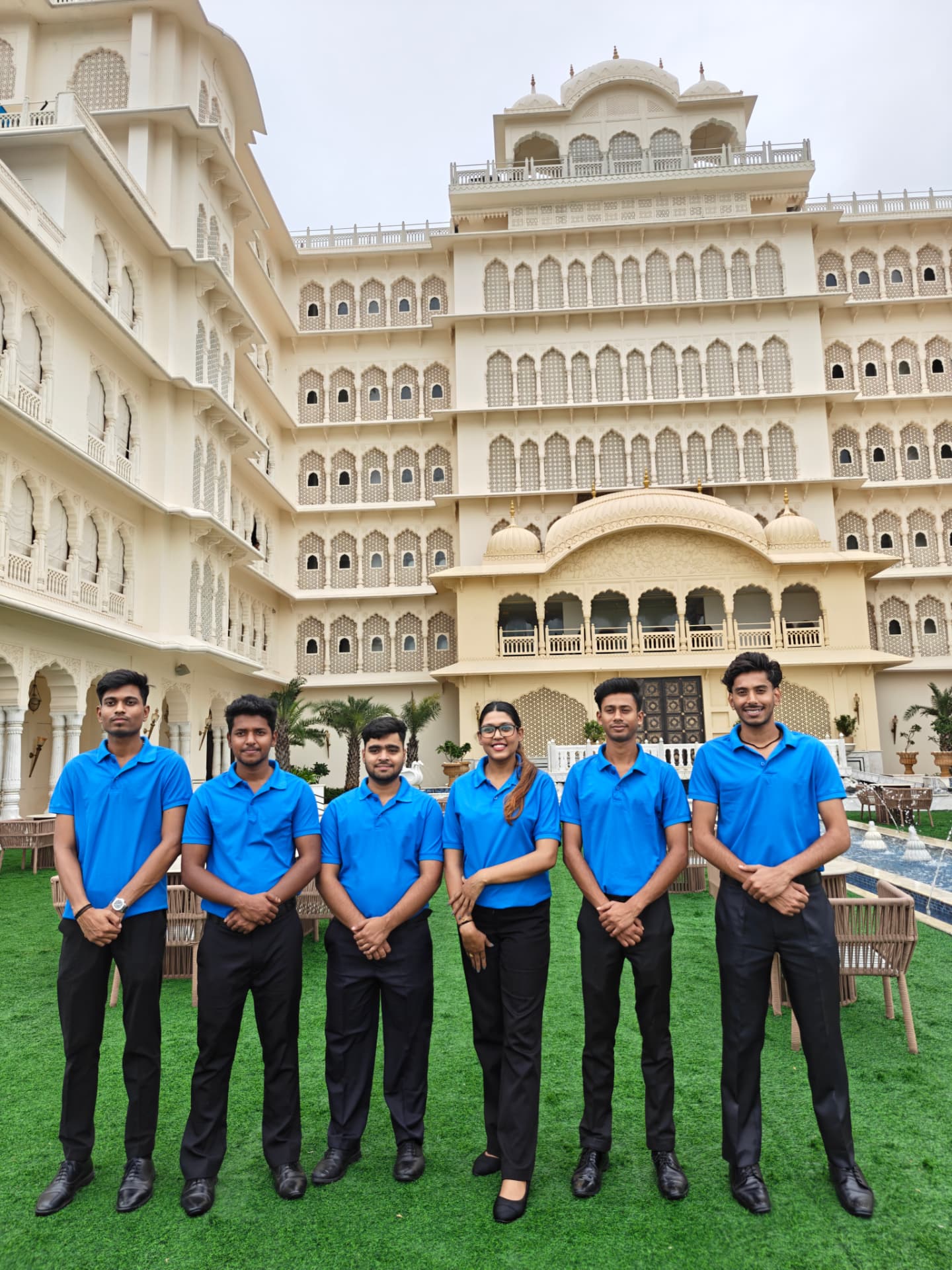 Harmony crew in blue uniforms at a palace hotel property