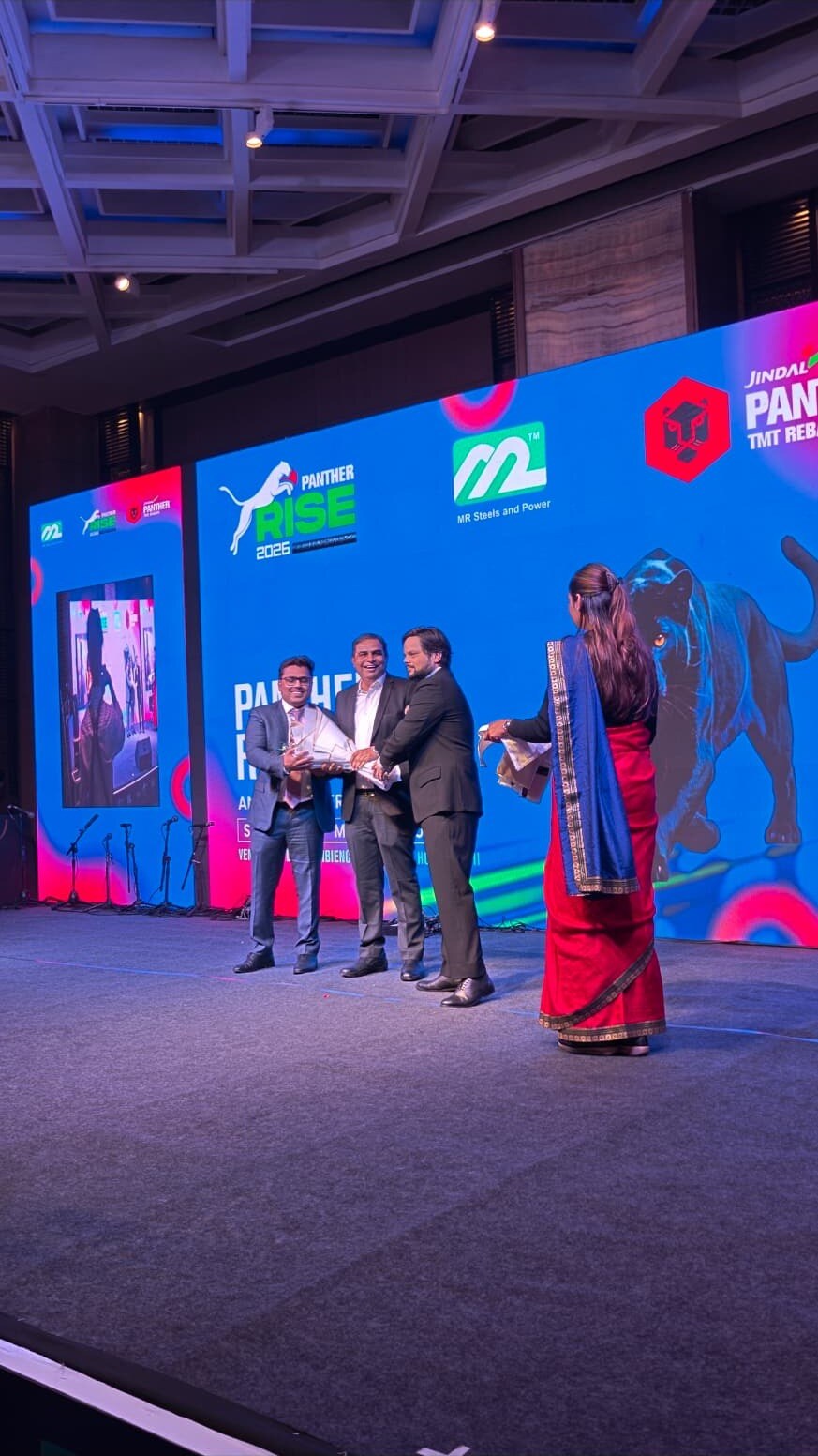Award presentation on stage at a corporate dealer conference