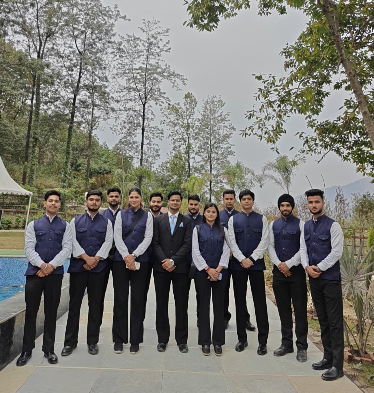 Harmony crew lined up at a poolside venue