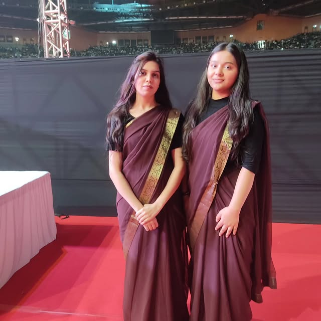 Harmony hostesses in signature sarees at an arena event